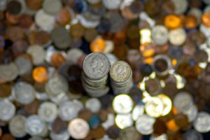 stacked coins shows reducing costs